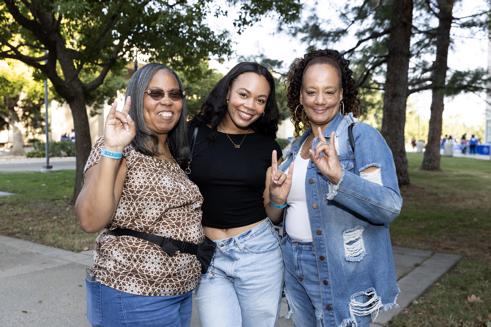 Three guests smile for the camera