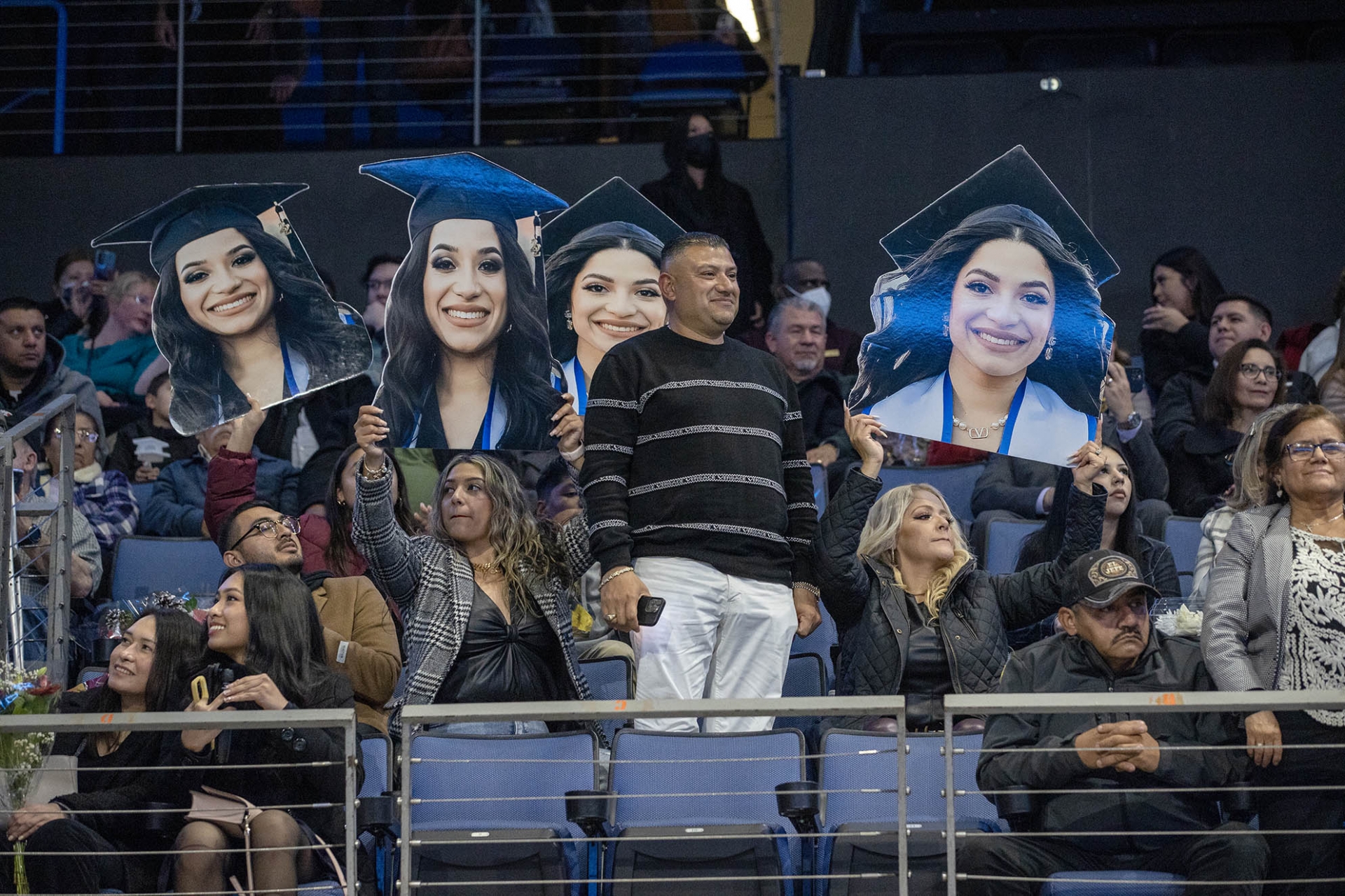 A family celebrates their graduate.