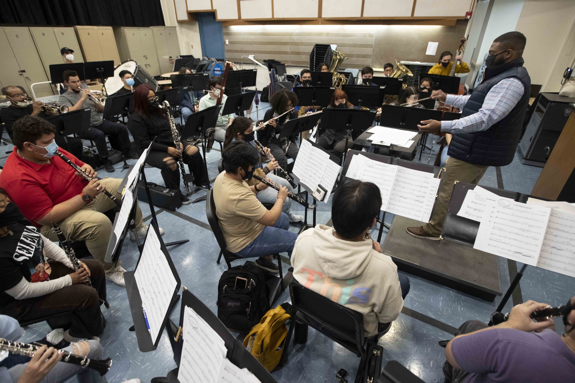 Nicholas Bratcher conducting during a music class.