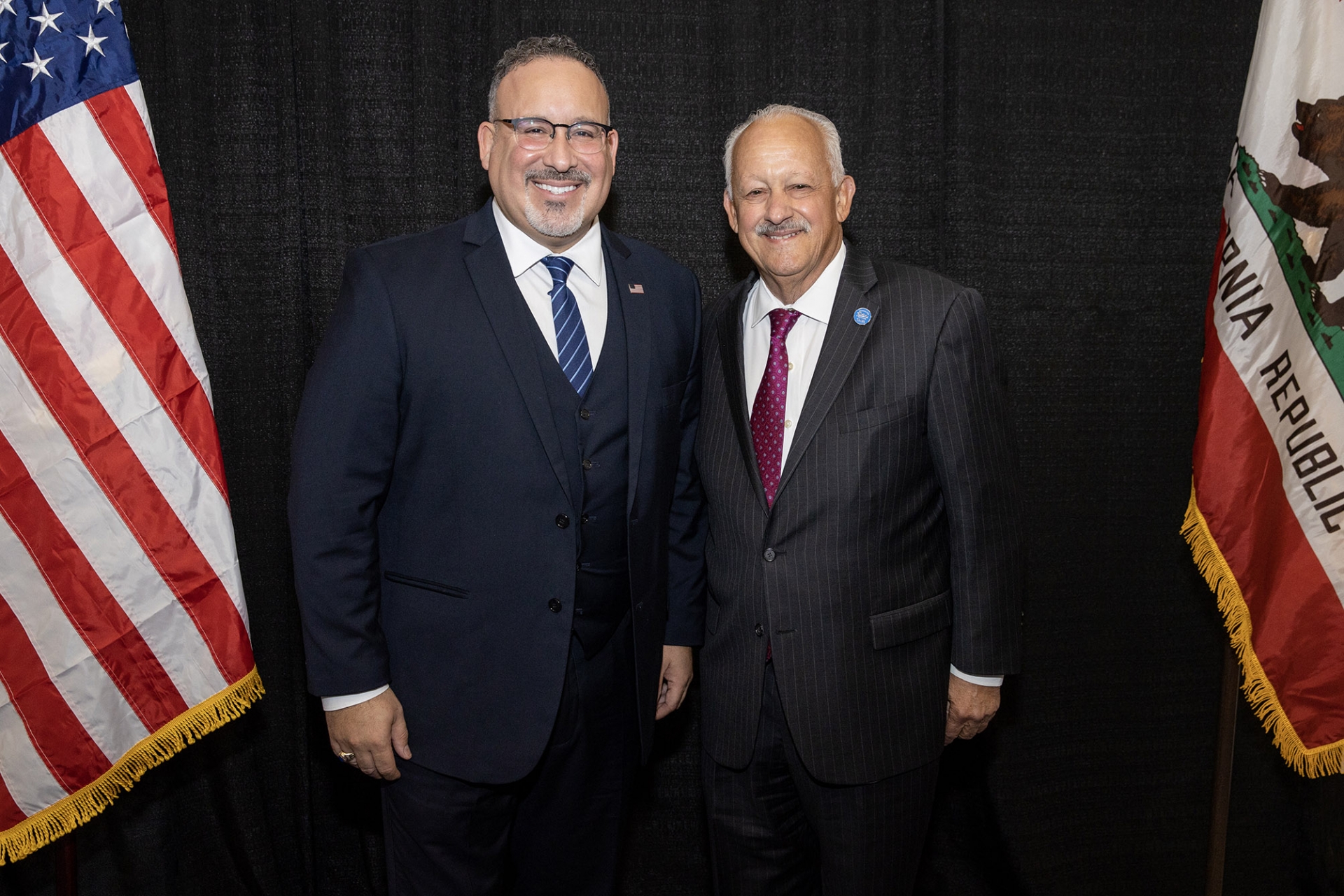 U.S. Secretary of Education Miguel Cardona (left) and CSUSB President Tomás D. Morales.