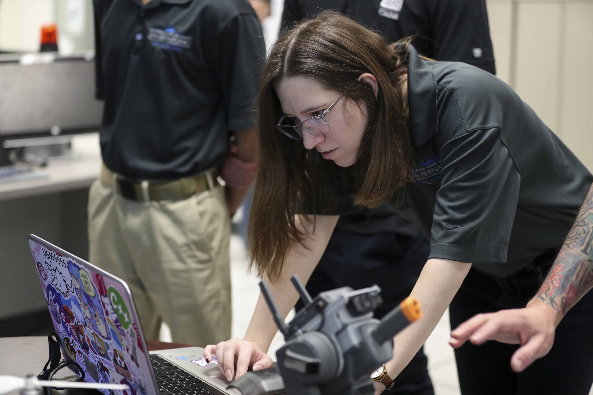 A student works on a laptop computer. Students accepted into the CyberCorps program will receive intensive hands-on training in all aspects of cybersecurity in addition to an excellent cybersecurity education. 