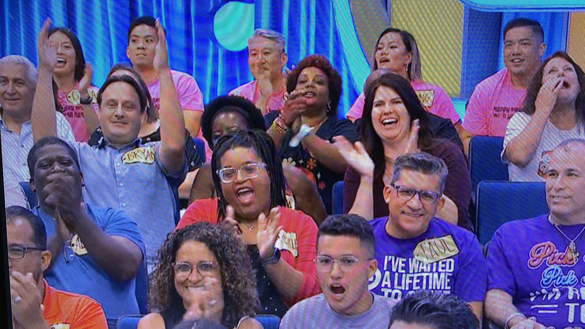 : Cheering for Kate Liszka are, from left, Bryan Kraemer (arms raised), research Egyptologist and educator at CSUSB’s Robert and Frances Fullerton Museum of Art; Annika Anderson (partially obscured), chair of the CSUSB sociology department; and Tiffany Jones, professor of history.