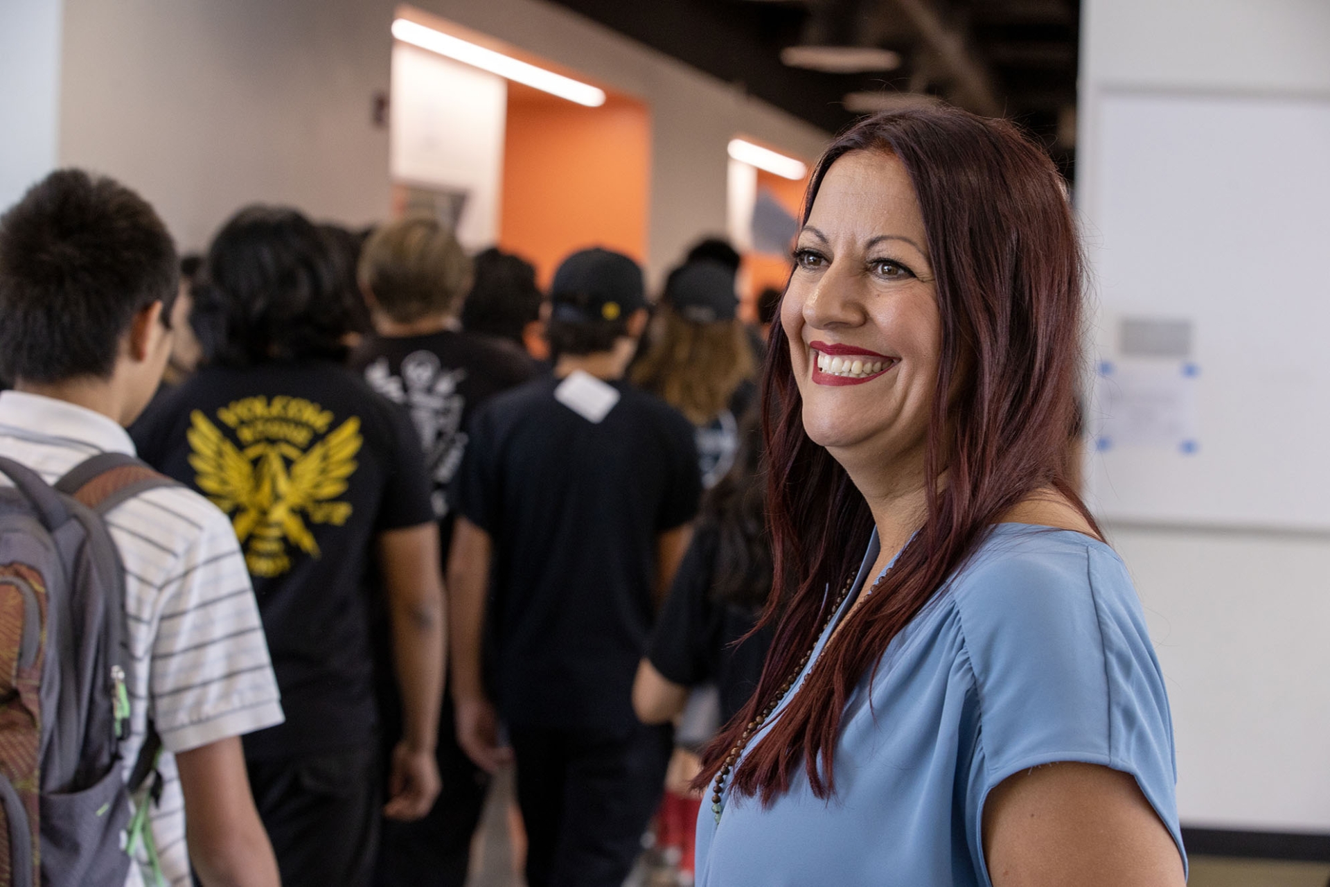 Erika Tejeda watches students in a Liberty High School hallway.