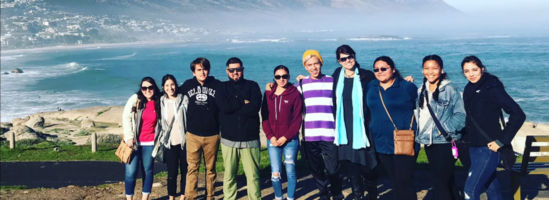 CSUSB students and Tiffany F. Jones, professor of history and department chair, in front of Camps Bay, Cape Town. Photo courtesy of Tiffany Jones