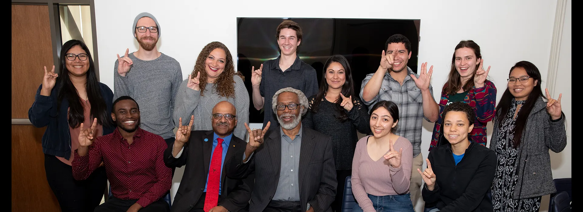 Sylvester James “Jim” Gates posing with CSUSB students and staff