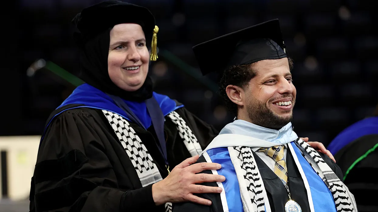 Ahlam Muhtaseb, professor of media studies, (left) with her former student, Naim Aburaddi ’22, (M.A., communication studies), 21-22 Outstanding Graduate Student for College of Arts and Letters, at the Toyota Arena in Ontario, Calif. for Spring Commencement on May 21, 2022.