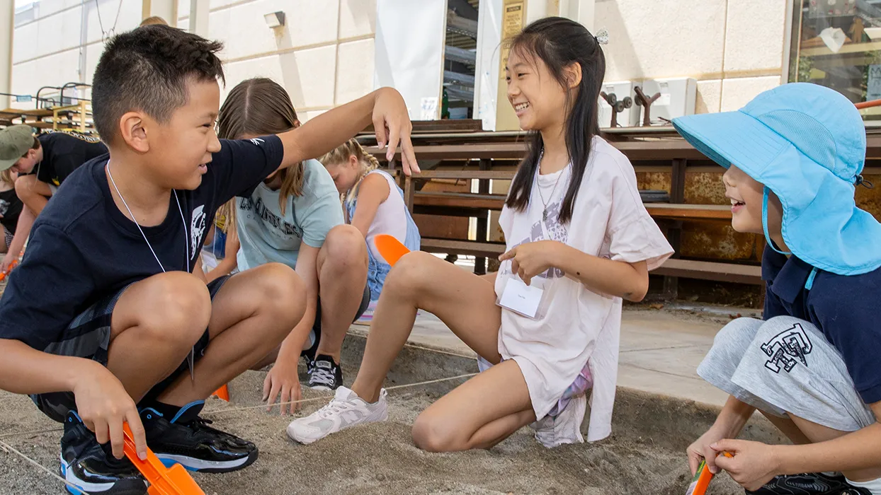 Young participants enjoy the archaeological dig activity at the Kids Discover Workshop, hosted by CSUSB’s Robert and Frances Fullerton Museum of Art, in July.