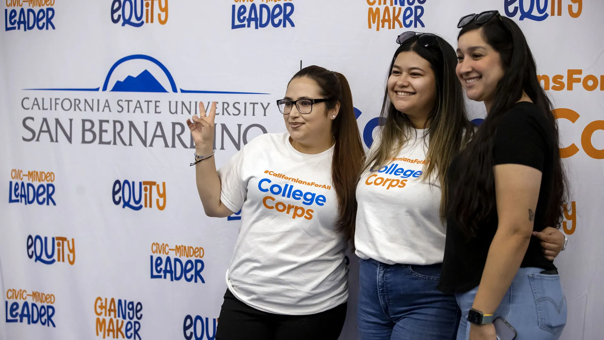 Three CSUSB students celebrate at the 2022 Californians For All College Corps Launch Party and Swearing-in Celebration for 58 CSUSB students joining the program. The university has been selected as a 2024-26 College Corps campus.