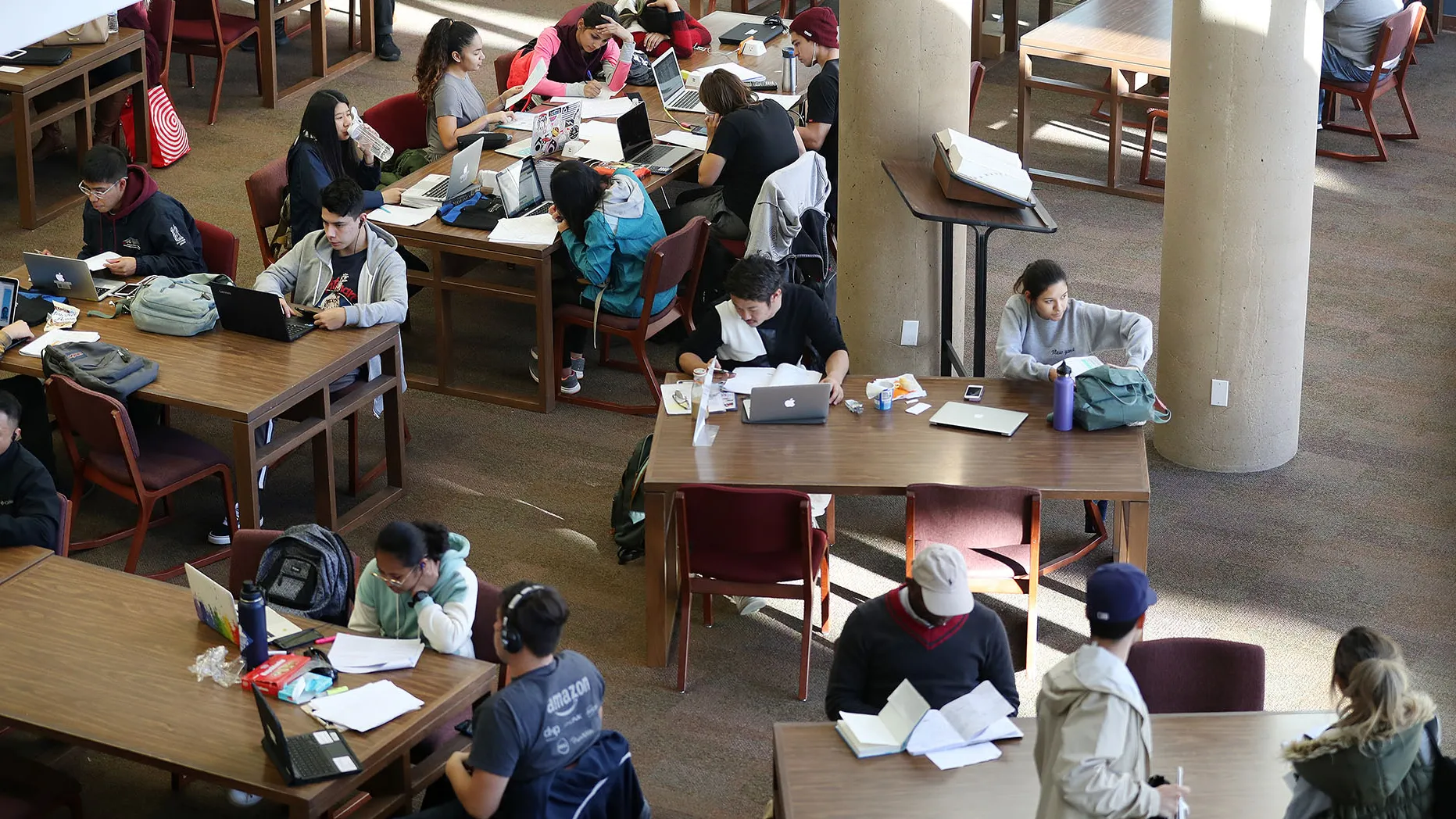 Students studying in the Pfau Library.
