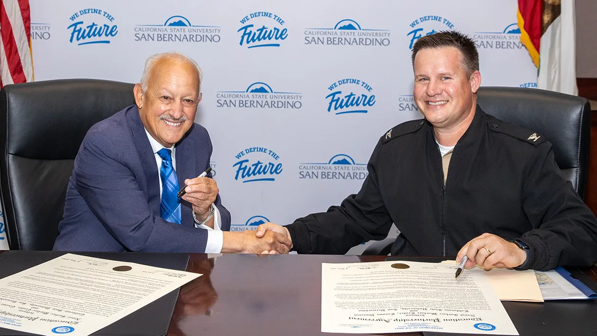 CSUSB President Tomás D. Morales (left) and Navy Capt. Joseph Burgon, commanding officer at NSWC Corona, signed the Education Partnership Agreement on May 5.