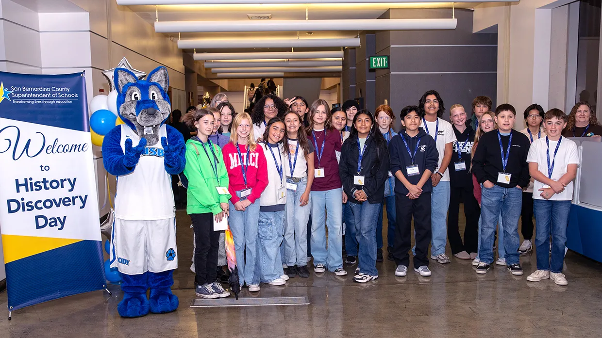 A group of middle school students make their way through the bookstacks at Cal State San Bernardino’s John M. Pfau Library during San Bernardino County History Discovery Day on Nov. 14.