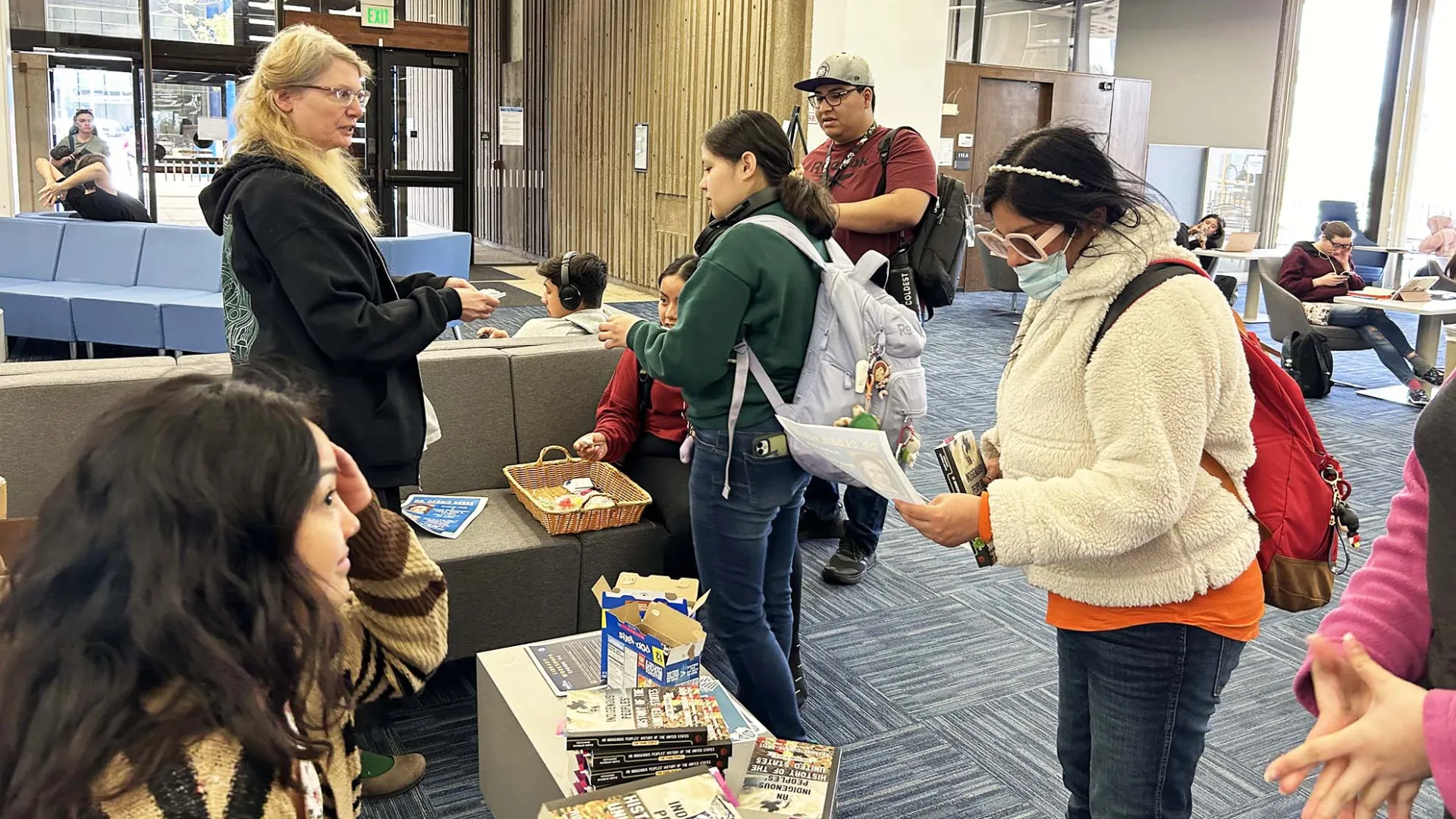 Rebecca Lubas, CSUSB Libraries dean, meets with students during the fall semester's first "Pop-Tart, Pop-in!" event, which continues each Monday at noon at the John M. Pfau Library.