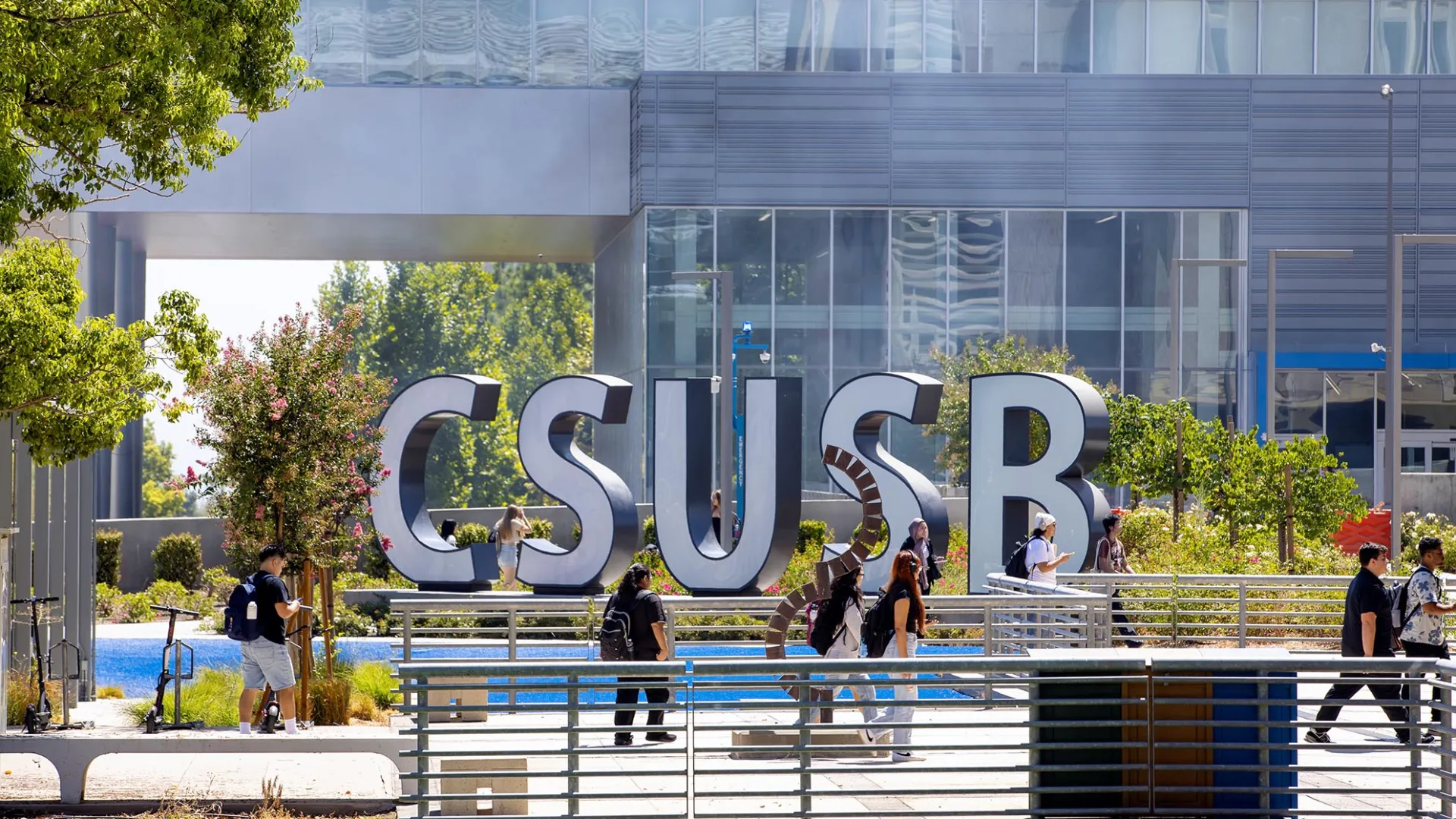 Students make their way past the CSUSB spirit letters