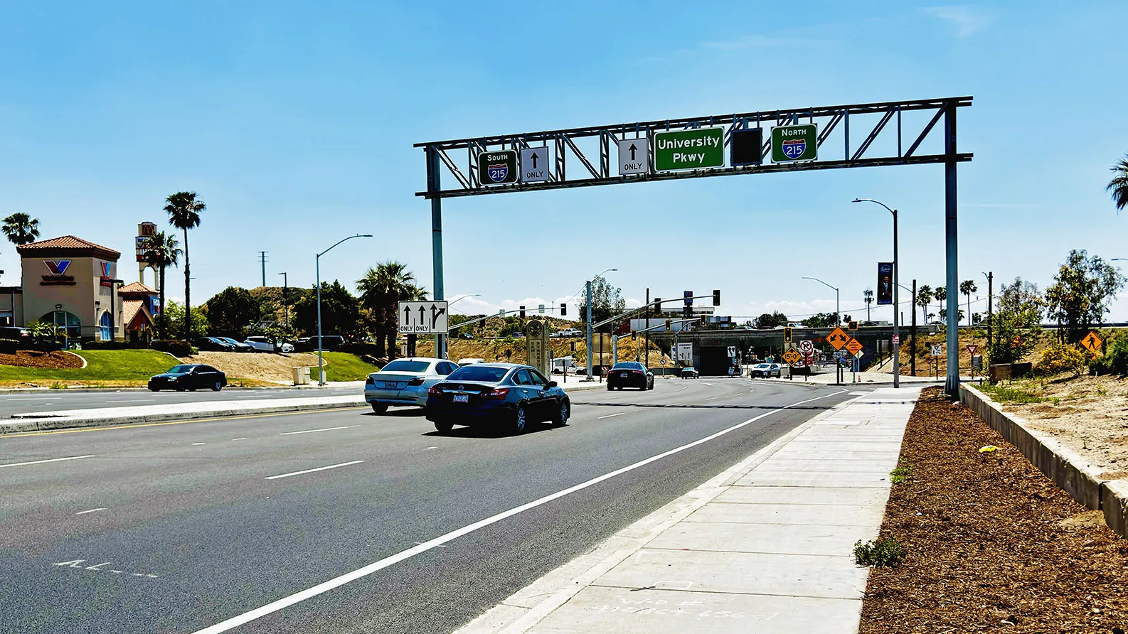 Traffic makes its way on University Parkway towards Interstate 215.