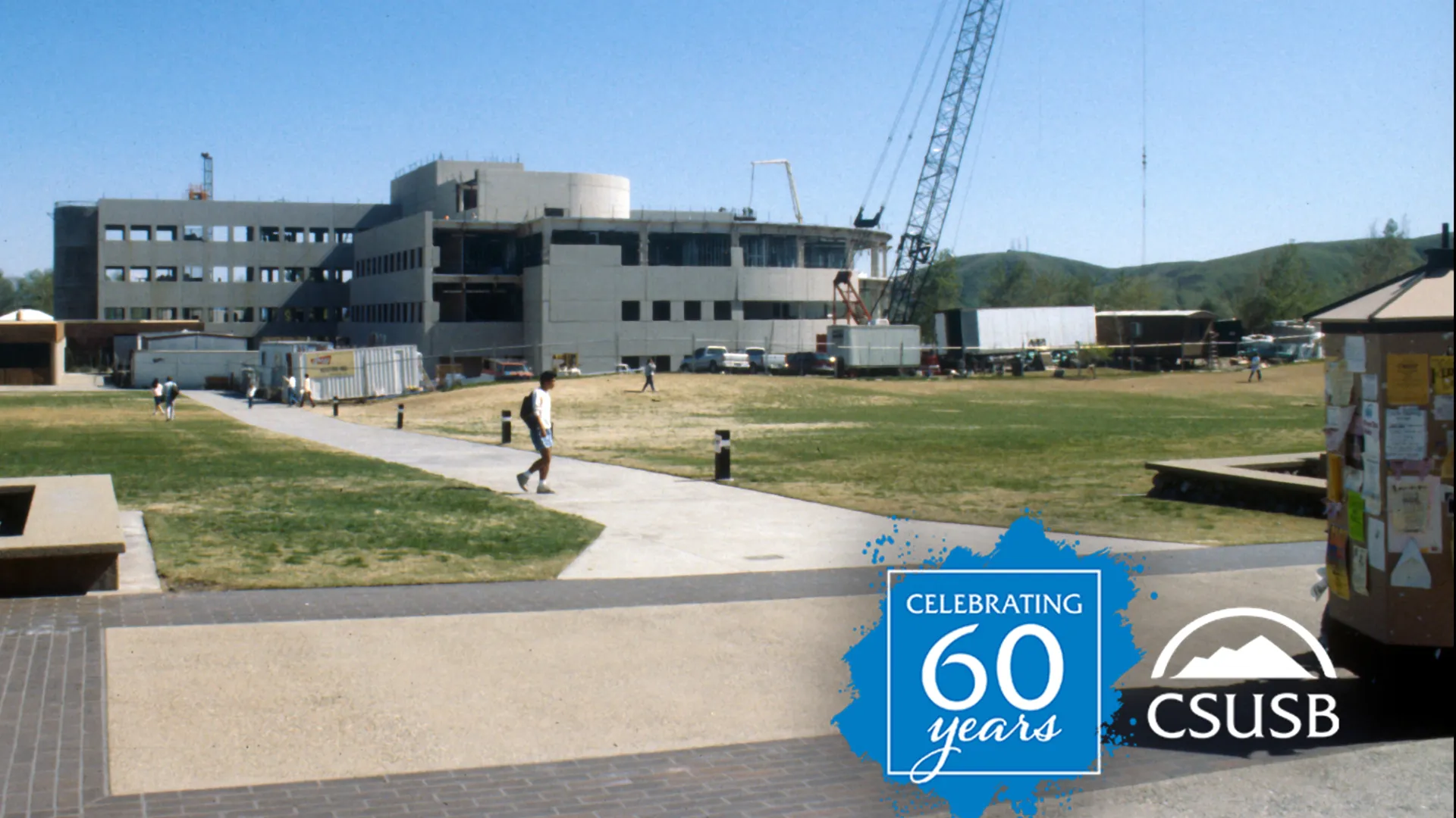 A crane stretches over the construction of University Hall in the 1990s, a decade of continuing growth on the Cal State San Bernardino campus.