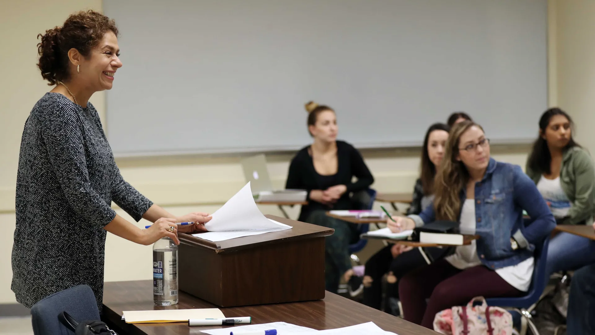 Parastou Feizzaringhalam teaching a class.