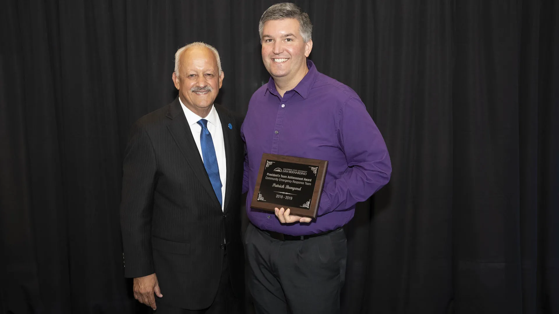 Patrick Bungard, at right, with CSUSB President Tomás D. Morales.