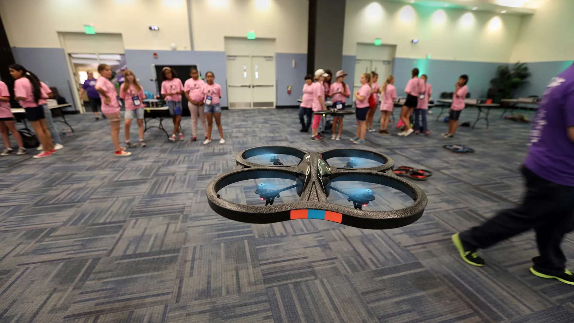 Photo from the 2016 GenCyber Camp of participants flying drones.