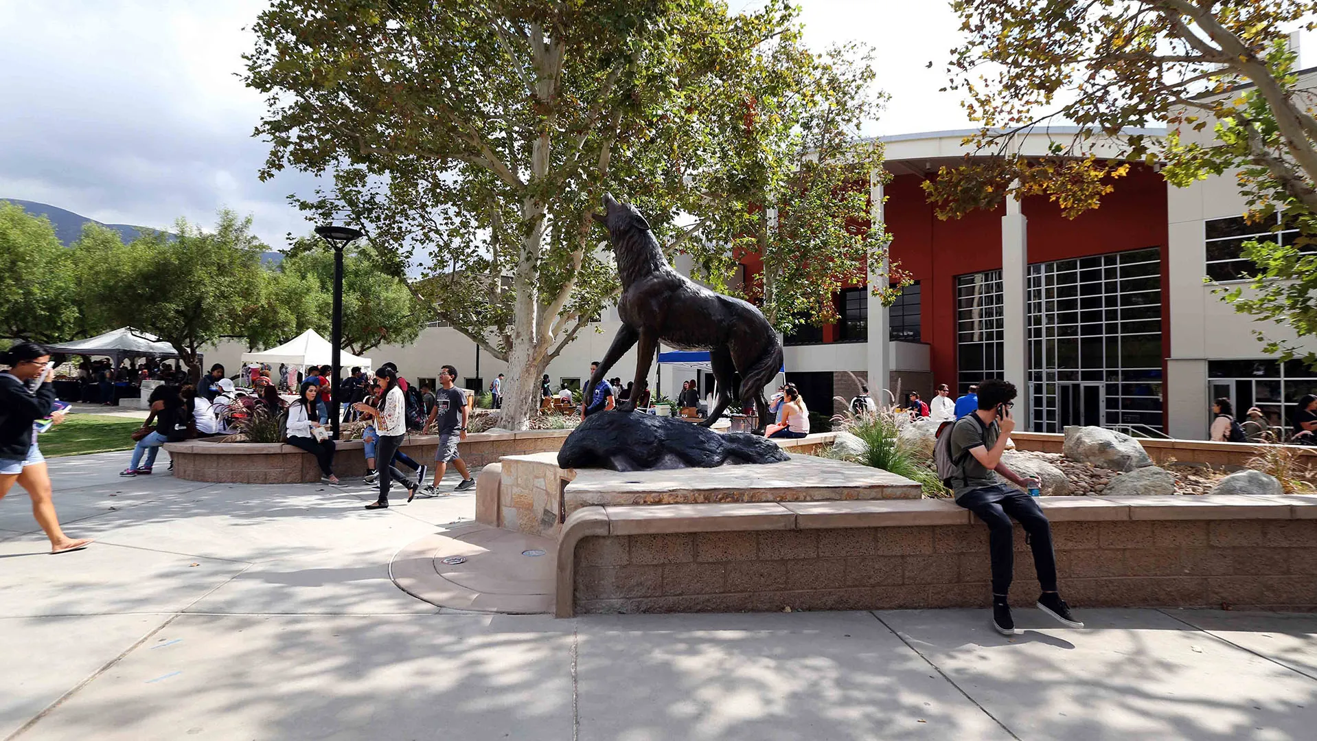 Students at the Wild Song statue