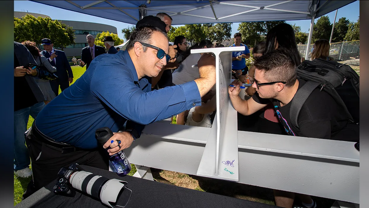 Campus community signs the beam