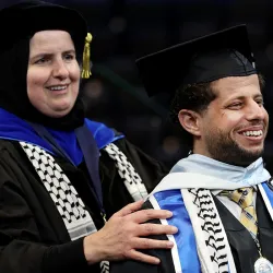 Ahlam Muhtaseb, professor of media studies, (left) with her former student, Naim Aburaddi ’22, (M.A., communication studies), 21-22 Outstanding Graduate Student for College of Arts and Letters, at the Toyota Arena in Ontario, Calif. for Spring Commencement on May 21, 2022.