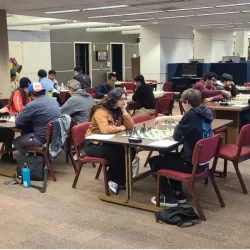 Participants in the Pfau Library’s third Chess Tournament face off against each other.