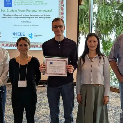 CSUSB student Nathan Kelly, center, was the recipient of the Best Student Poster Presentation Award at the 11th annual IEEE International Conference on Data Science and Advanced Analytics (DSAA) in San Diego.