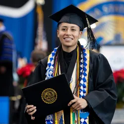 Graduates were all smiles at CSUSB’s fall commencement ceremonies, held Dec. 12-13 at Coussoulis Arena. 