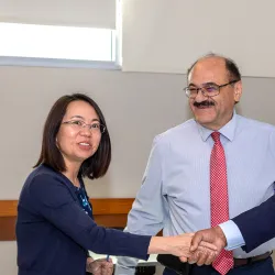 From left, Yan Zhang, associate professor and recipient of the 2024-25 Outstanding Service Award; Khalil Dajani, chair of the School of Computer Science and Engineering; and Provost and Vice President of Academic Affairs Rafik Mohamed.