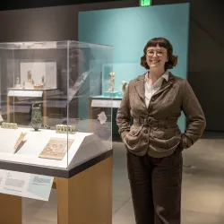 Emily Smith-Sangster among the Robert and Frances Fullerton Museum of Art’s collection of Ancient Egyptian artifacts.
