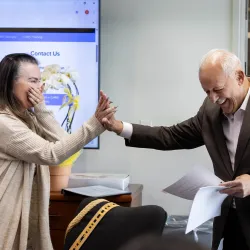 Rachel Estrada, left, and CSUSB President Tomás D. Morales exchange a high five as the president announces that she is the recipient of CSUSB’s 2024-25 Outstanding Lecturer Award.