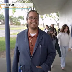 Jacobo Lopez (left), a Project Impact graduate, walks with some of his students at the Rialto elementary school where he now teachers, in a clip from the “Inside California Education” report, “Project Impact: Diversifying the Teacher Workforce.”