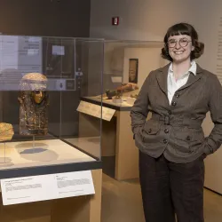 Emily Smith-Sangster among the Robert and Frances Fullerton Museum of Art’s collection of Ancient Egyptian artifacts.