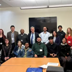 Members of the research team pose at a conference.