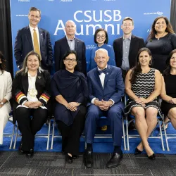 Back row from left, Raymond Watts, CSUSB interim vice president, University Advancement; Michael Bracken, Paw Print Award winner; Sapira Cheuk, Paw Print Award winner; Adam Huttenlocker, Paw Print Award winner; and Crystal Wymer-Lucero, director, CSUSB Alumni Relations. Front row from left, Miki R. Inbody, Paw Print Award winner; Laurena Bolden, Paw Print Award winner; Diana Z. Rodriguez, Distinguished Alumni Award winner; CSUSB President Tomás D. Morales; Natalie Hale, Coyote Spirit Award winner; and Miran