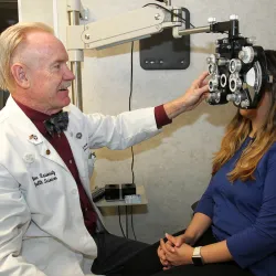 Dr. Bennett McAllister conducts an eye exam at the mobile eye clinic