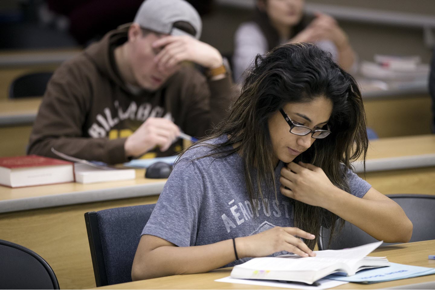 Student reading textbook