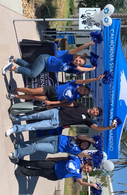 Image of students with pom poms