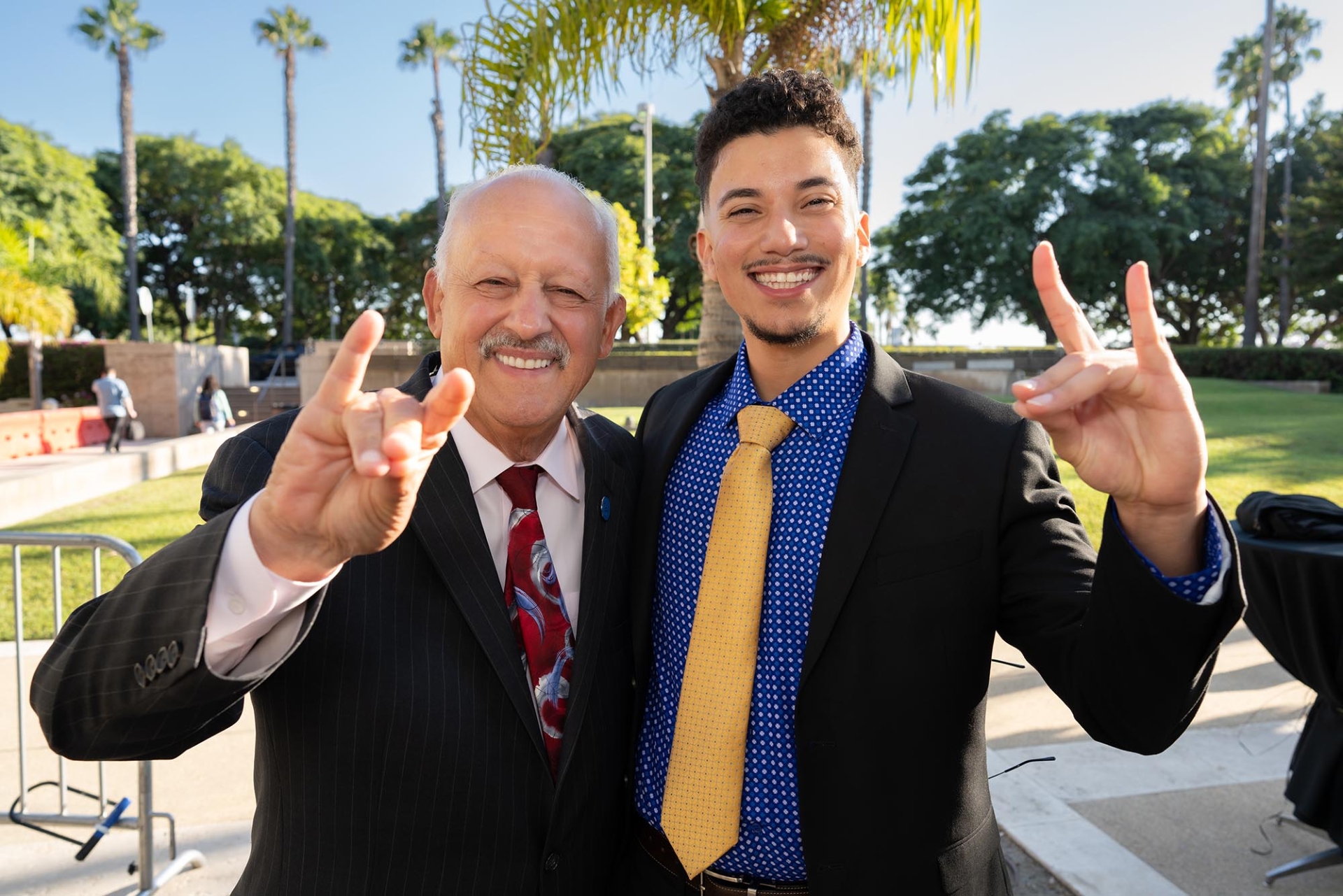 CSUSB President Tomas Morales (left) and student Juan Sibrian