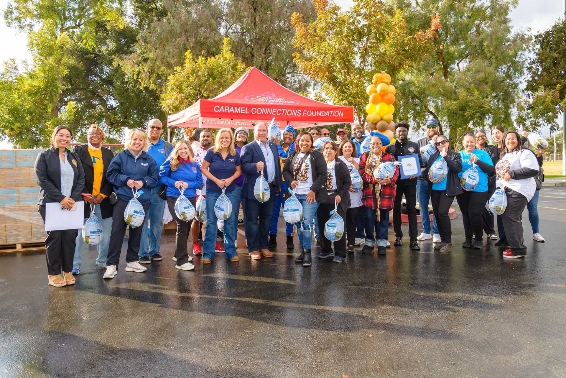 Stakeholders and volunteers at the Caramel Connections Foundation’s Food and Resource Giveaway Rally