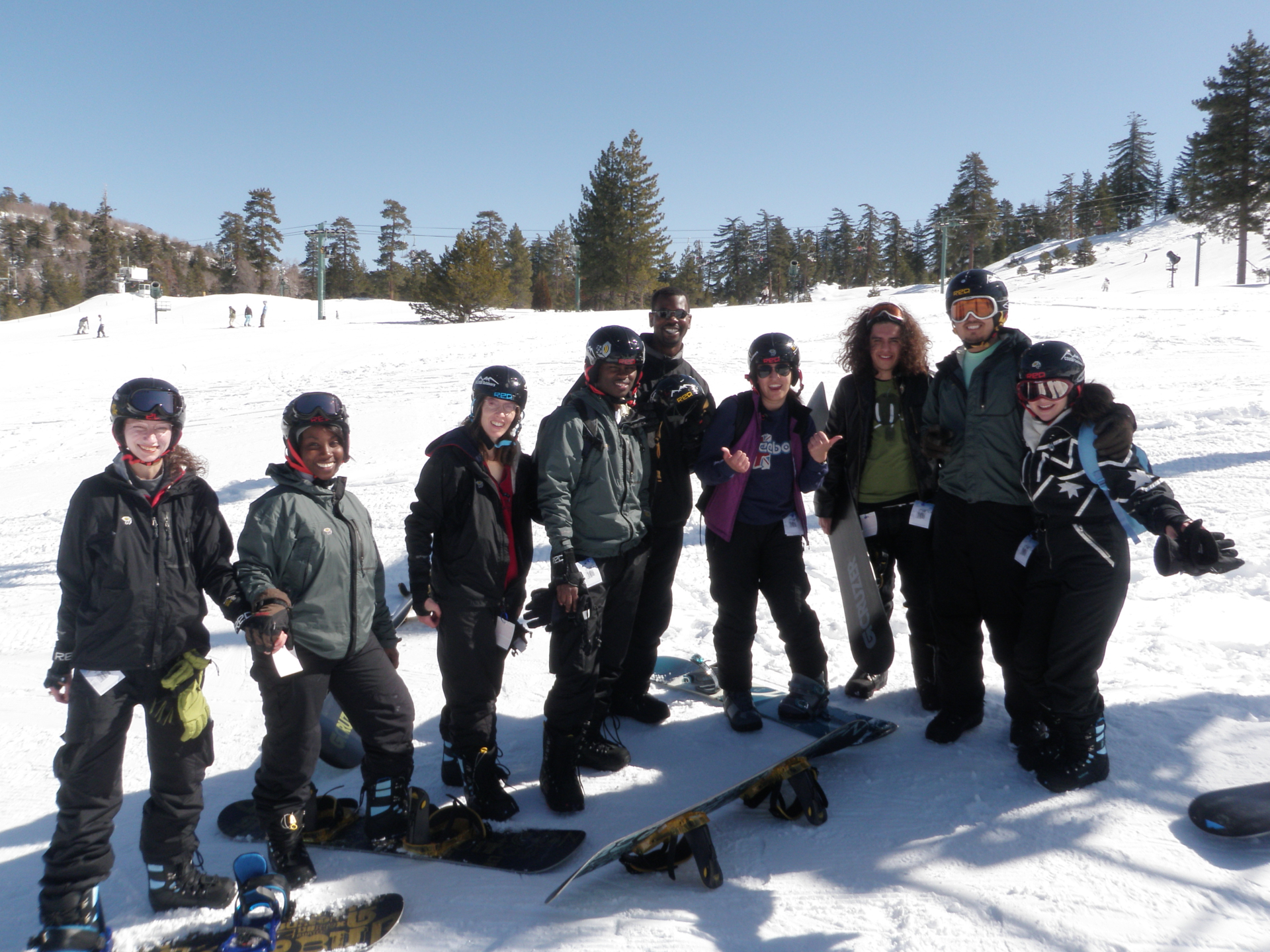 group of snowboards on snow covered slope
