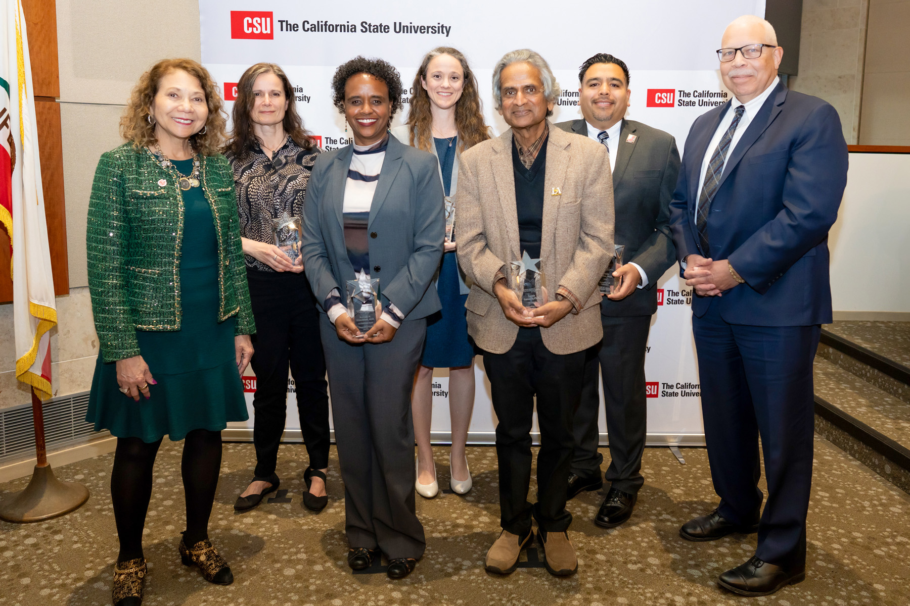 The California State University honored the 2025 recipients of the Wang Family Awards on Jan. 28. From left: CSU Chancellor Mildred García; Gisela Bichler, CSUSB professor of criminal justice, Outstanding Faculty Scholarship; Rashida M. Crutchfield, Cal State Long Beach professor of social work, Outstanding Faculty Service; Kimberly Stillmaker, associate professor of civil engineering, Fresno State, Outstanding Faculty Innovator in Student Success; Nanda Ganesan, professor of information systems, Cal State Los Angeles, Outstanding Faculty Teaching; Freddie Sánchez, interim assistant vice president of Student Affairs, Equity & Inclusion, Cal State Northridge, Outstanding Staff Performance; Jack B. Clark Jr, chair of the CSU Board of Trustees.