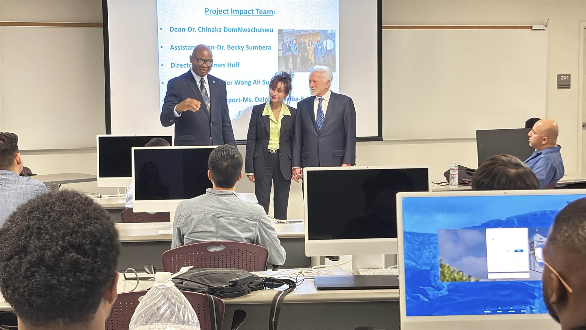 From left: Chinaka DomNwachukwu, dean of the James R. Watson and Judy Rodriguez Waston College of Education, Judy Rodriguez Watson and James R. Watson, at a meeting of Project Impact students and faculty in February 2025, the day a PBS crew visited to film for its segment, “Project Impact: Diversifying the Teacher Workforce.”