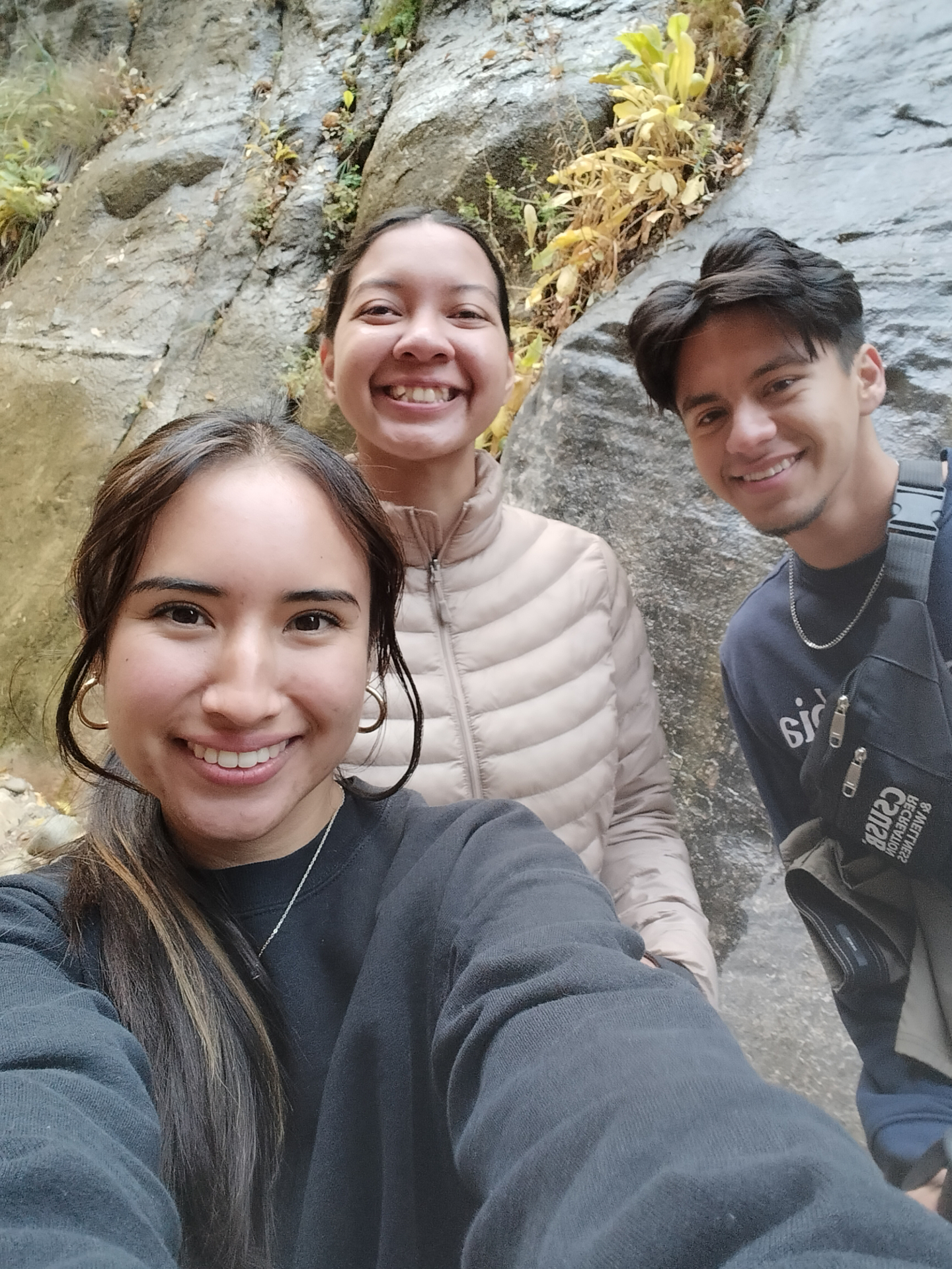 3 trip leaders taking a selfie in the narrows, zion national park