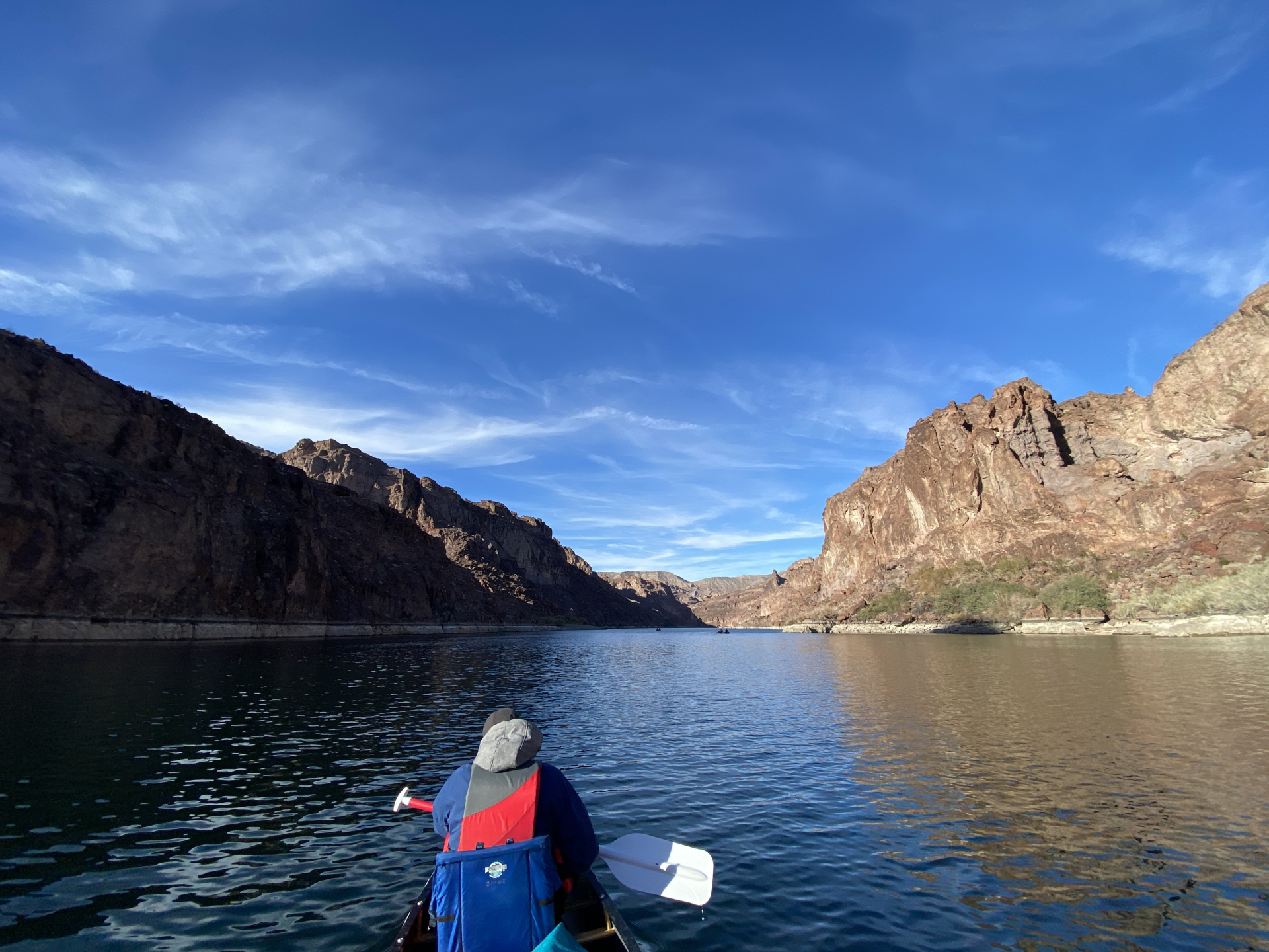 paddling a canoe on river