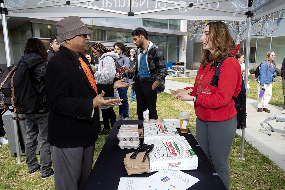 CNS dean and student at Standup For Science event.