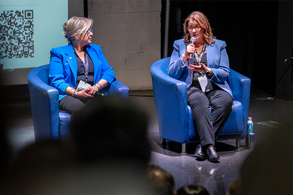 Panelists included, on left, Paniz Herrera, cybersecurity and AI executive at Deloitte, and Ginger Ontiveros, president and CEO of Tomorrow’s Talent.
