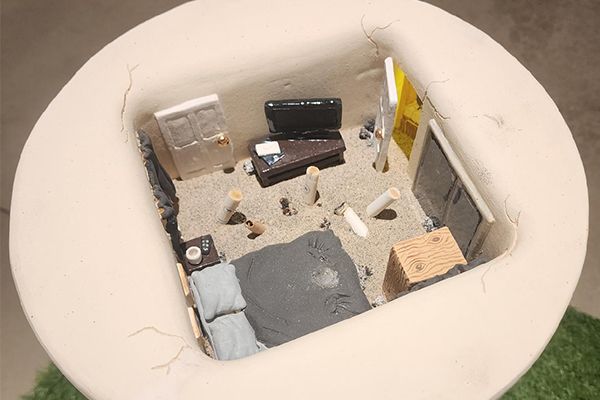 A close-up of McMullen’s piece, “Three Months in the House of a Rapist (2023),” for which she won Best in Show.