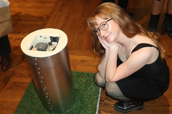 McMullen with her award-winning piece, “Three Months in the House of a Rapist (2023).”