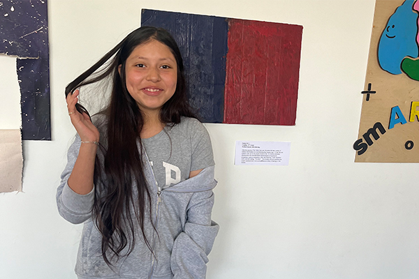 Emily’s piece, “Untitled,” explores the intense sadness and anger that she experienced after her father’s passing in 2023. Her artwork features a dual-sided canvas with blue melted crayons and the words, "I can’t anymore," contrasted with a red side stating, "I’m sorry," as a letter of apology to her mother.
